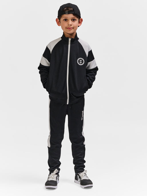 Dreng med Hummel Runner Zip jakke black
